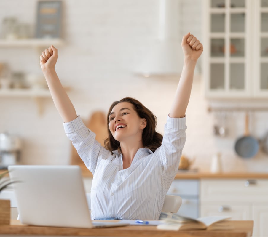 online course student happy after passing exam