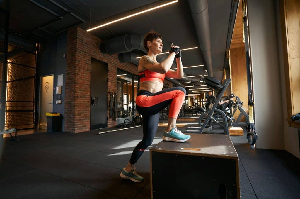 nsca cscs Sportswoman doing plyometric training in fitness club