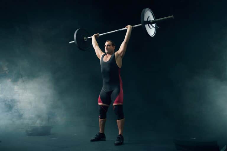 Strong weight lifter in sportswear takes a weight nsca cscs exam